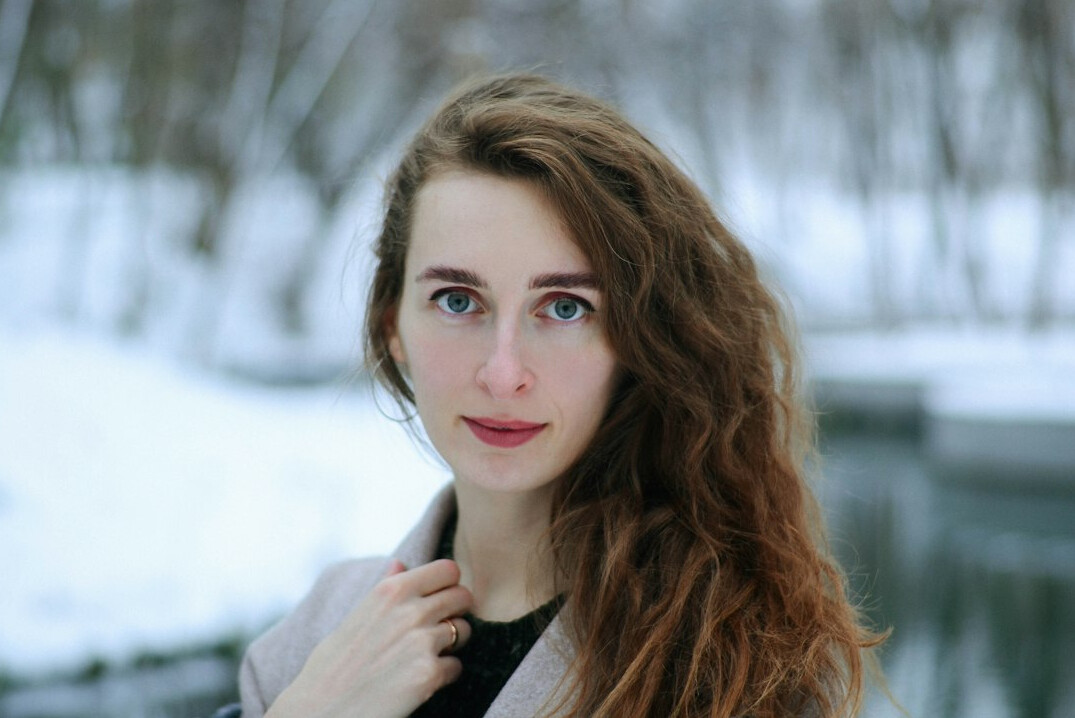 Studio portrait of a Uruguayan woman in her mid-thirties, editor