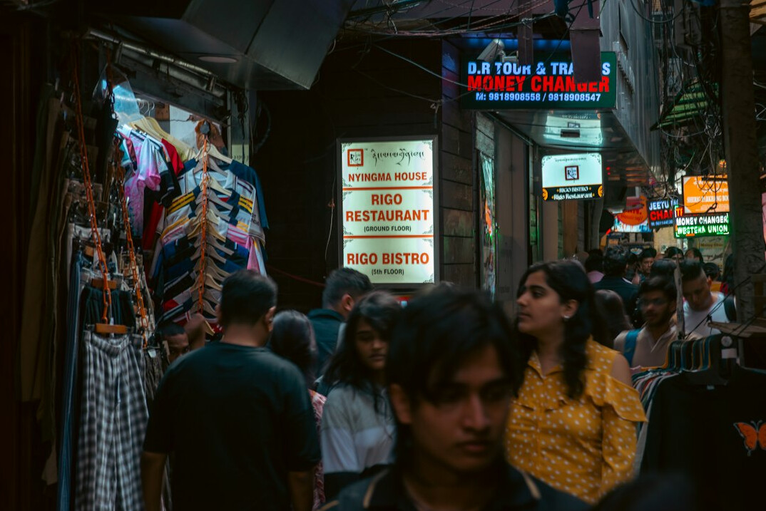 group of shoppers in crowded store