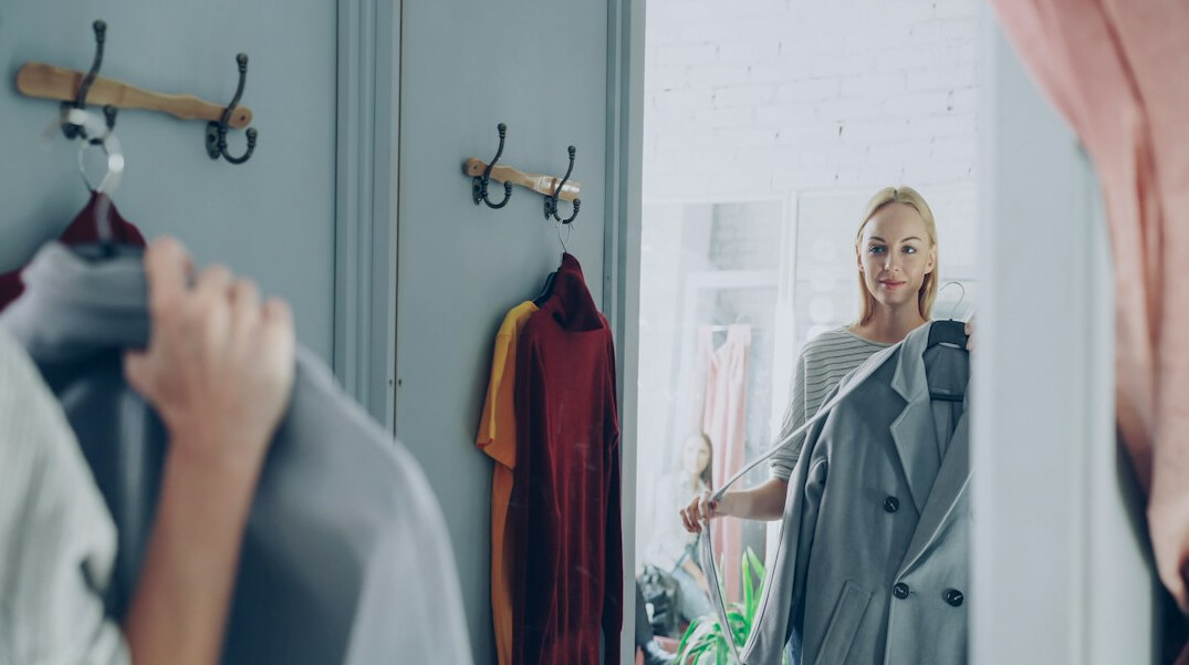 woman trying clothes in fitting room